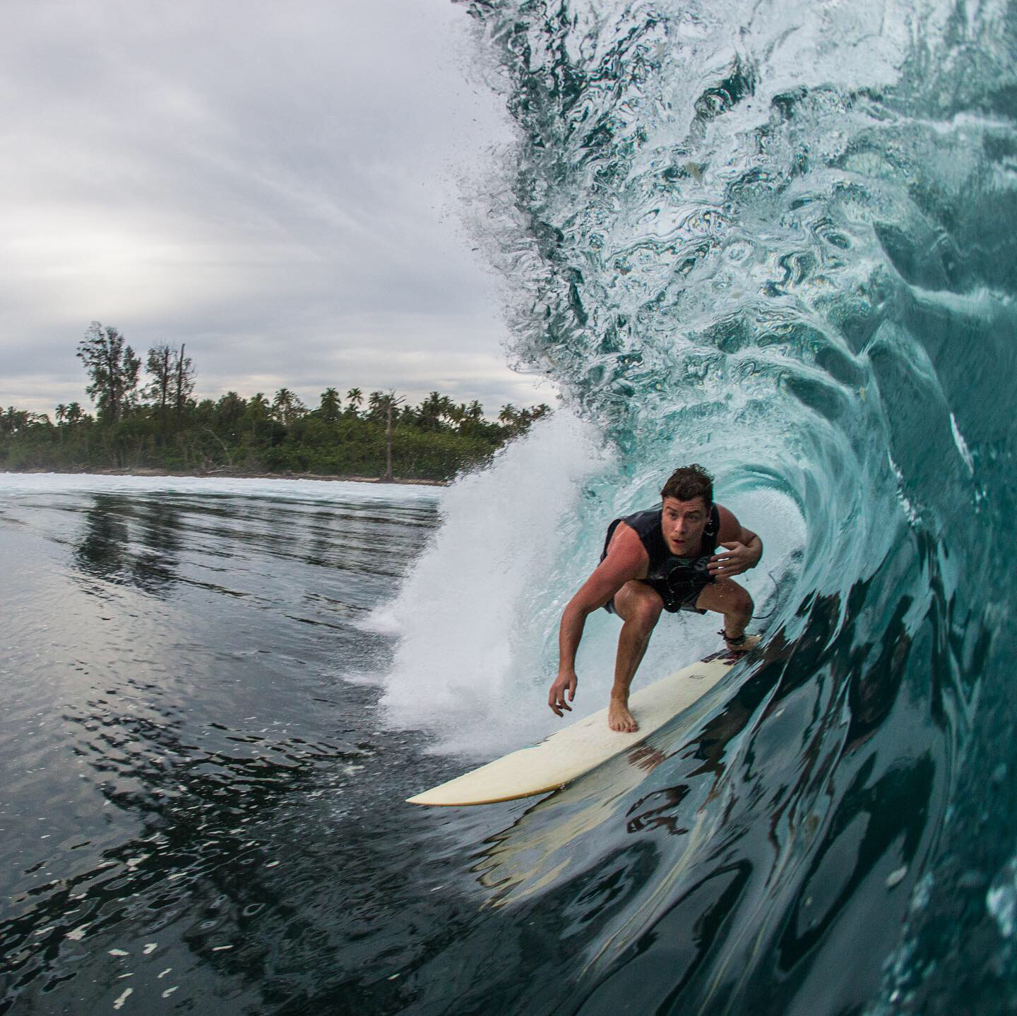 Tom Wegner surfing around the Mentawai islands in Indonesia